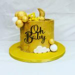 Gold baby shower cake