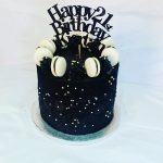 Black macaron decorated cake